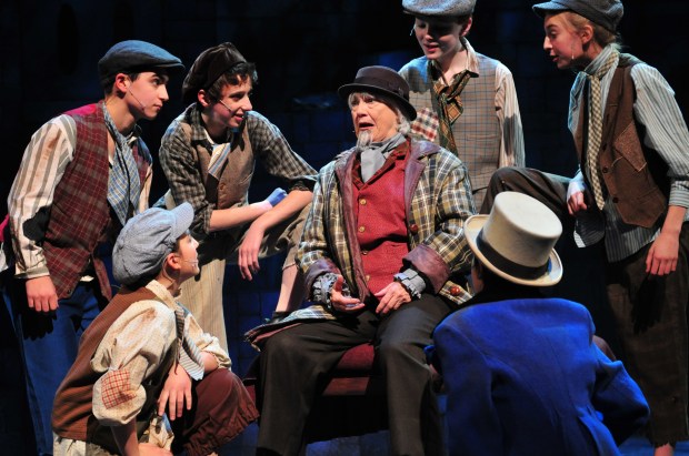 Jane Staab as Fagin and her crew of juvenile pickpockets in "Oliver." Photo: Gary Ng.