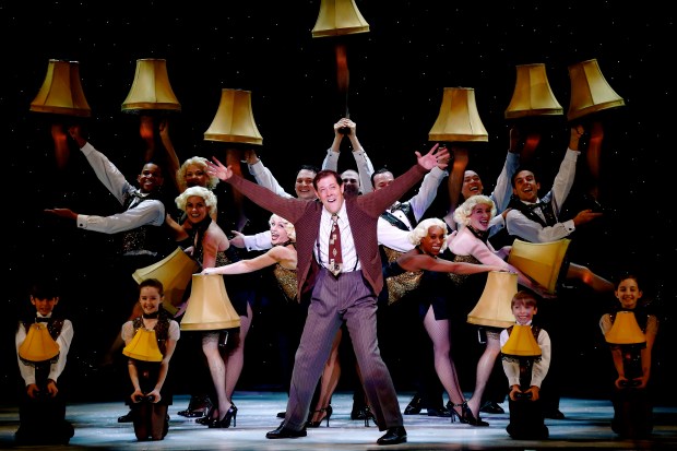 JOHN BOLTON (center) and company in a scene from A CHRISTMAS STORY, THE MUSICAL. photo credit: (c) 2013 Carol Rosegg 