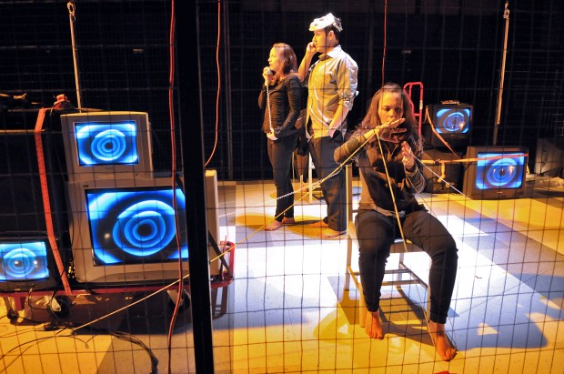 Stacy Fischer, Greg Maraio and McCaela Donovan make a phone call in a scene from "Necessary Monsters." Photo: Craig Bailey/Perspective Photo