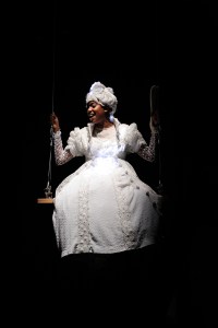 Whitney White as Ghost of Christmas Past in Charles Dickens' A Christmas Carol at Trinity  Rep, directed by Curt Columbus. Set design by Deb O, costume design by Toni Spadafora,  lighting design by Josh Epstein. Photo Mark Turek.